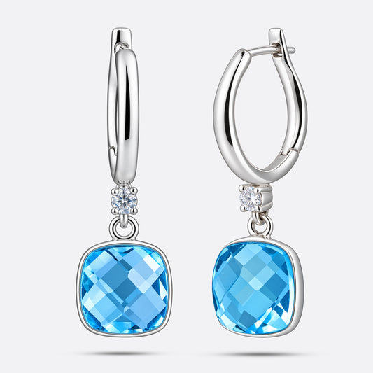 Front and side views of the silver drop hoop earrings, showing the faceted aqua chalcedony and the thickness of its setting.