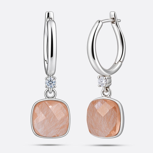 Front and angled views of RILAVE sterling silver drop hoop earrings with cushion-shaped golden rutilated quartz stones.