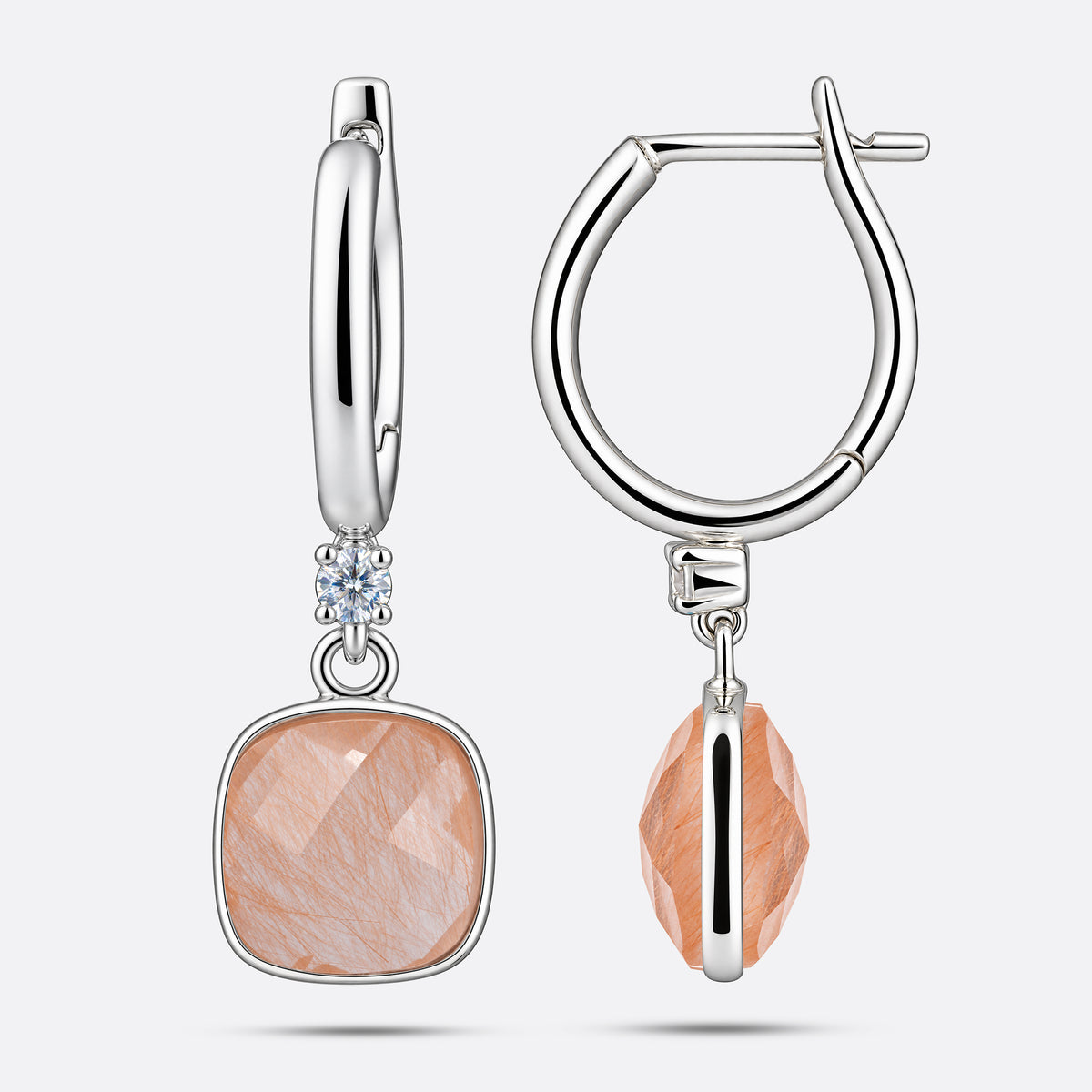 Front and side views of golden rutilated quartz drop hoop earrings, showing the silver settings and hinged clasps.