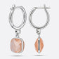 Rear and side views of golden rutilated quartz drop hoop earrings, showing RILAVE and 925 engravings on the silver hoop.