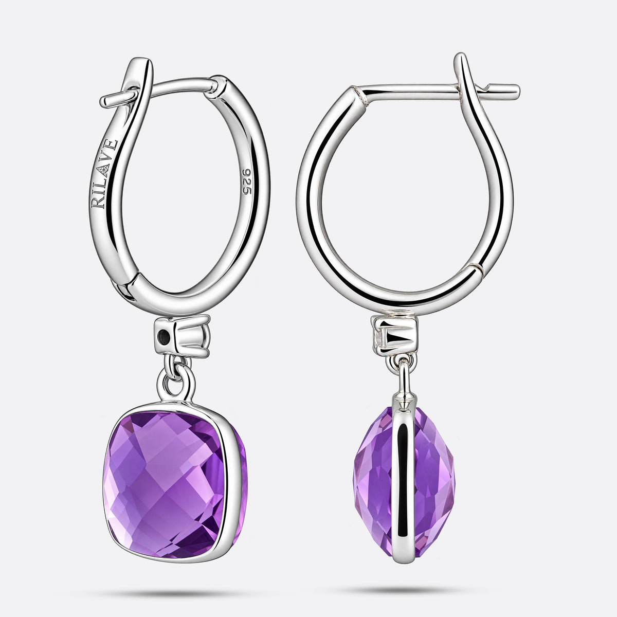 The reverse side of two sterling silver hoop earrings, clearly displaying the hinged clasps, 925 hallmark and RILAVE engraving.