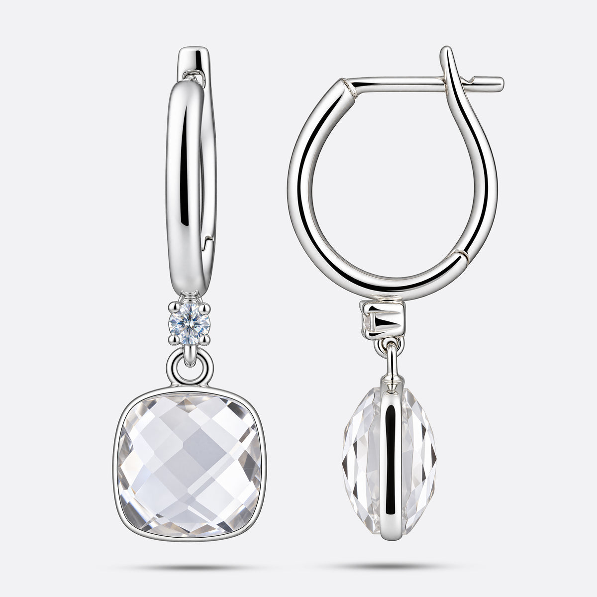 Pair of White Topaz drop earrings in sterling silver, displaying the front faceted cut and the structured side profile setting.