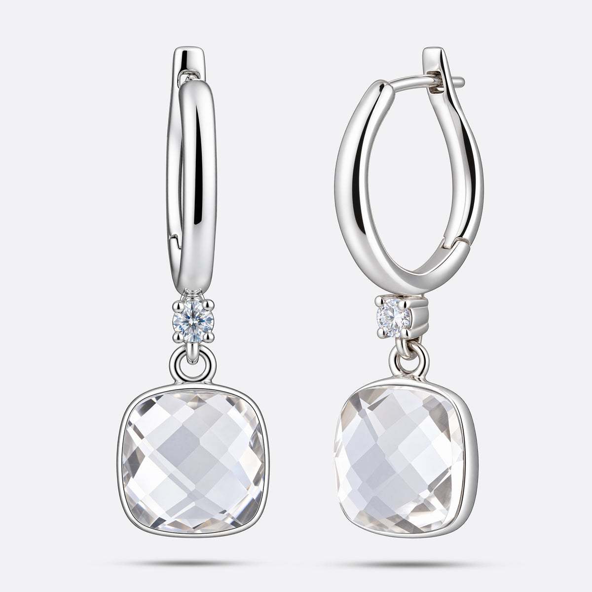 Sterling silver drop hoop earrings featuring a brilliant White Topaz, shown from straight and slightly angled front perspectives.