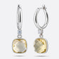 RILAVE Lemon Quartz drop hoop earrings in sterling silver, showing pale yellow cushion-cut stones and round clear accents.