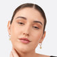 Front-facing portrait of a model wearing sterling silver Lemon Quartz drop hoop earrings, with both yellow gemstone drops visible.