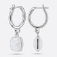 Reverse and side views of RILAVE Rainbow Moonstone drop hoop earrings, revealing the brand engraving, 925 stamp and hinged posts.